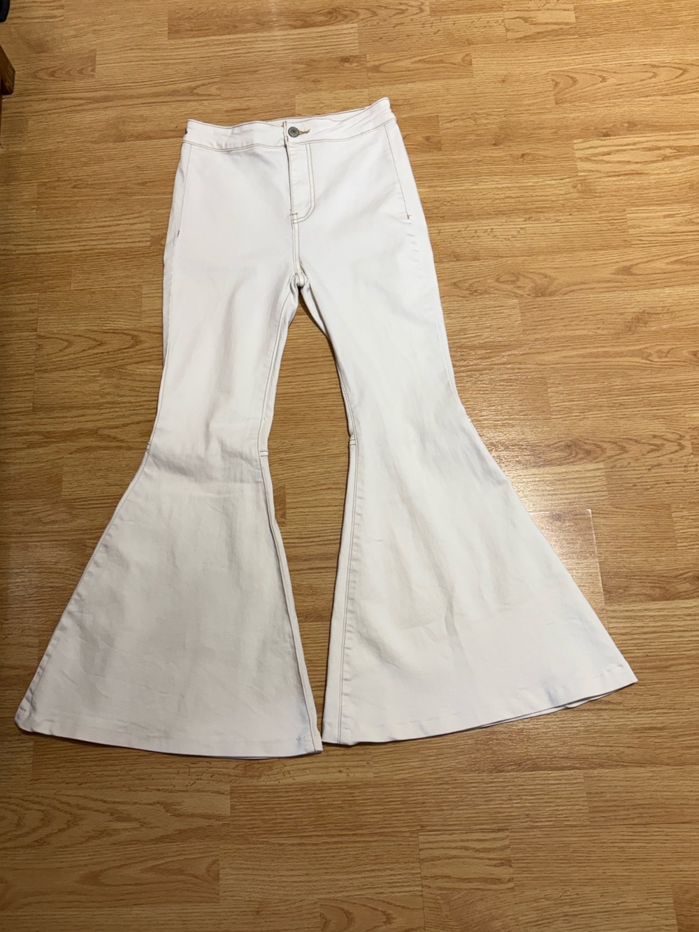 We the Free float on flare jeans.  Cream color.